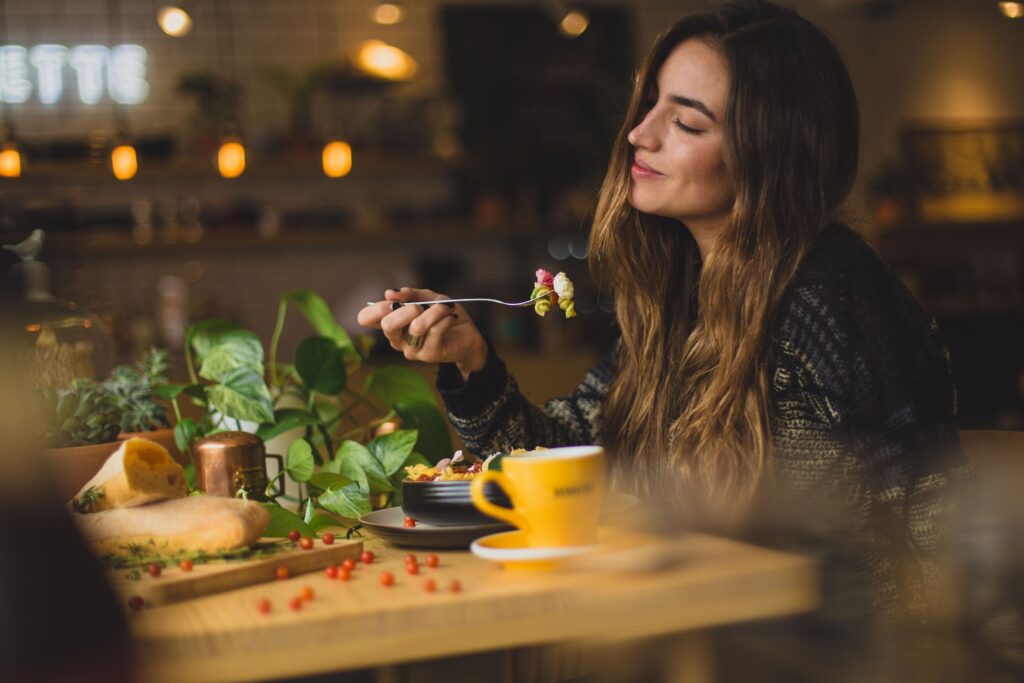 A woman eating at dinner