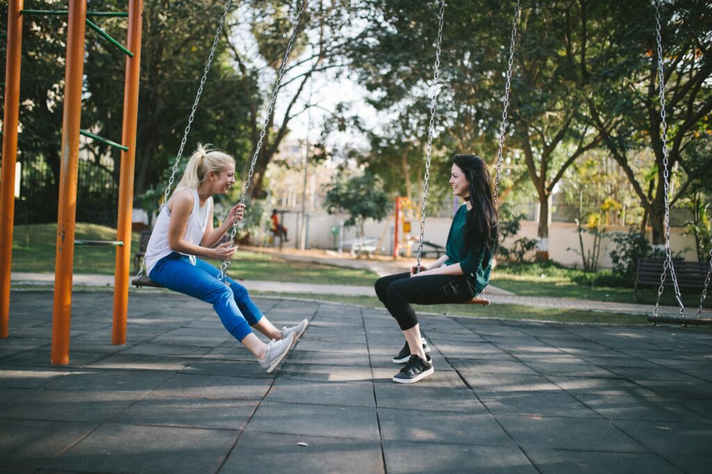 Two women on a swing