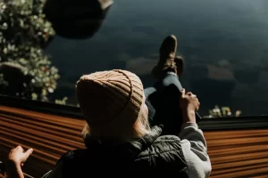 a woman sitting on a ledge